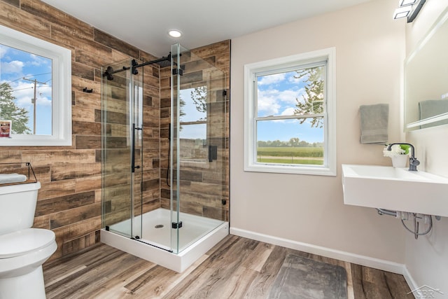 6835 Hackett Rd, Freeland, MI 48623 - full bath featuring wood finished floors, a stall shower, and recessed lighting
