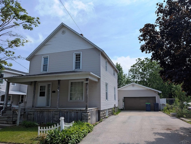 208 State St, Bay City, MI 48706 - view of front of house featuring an outbuilding, a garage, and a porch