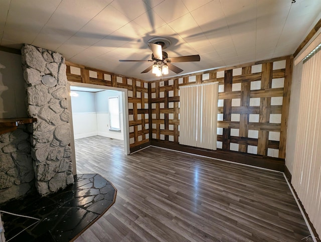 208 State St, Bay City, MI 48706 - unfurnished living room with dark wood-type flooring, ceiling fan, and baseboards