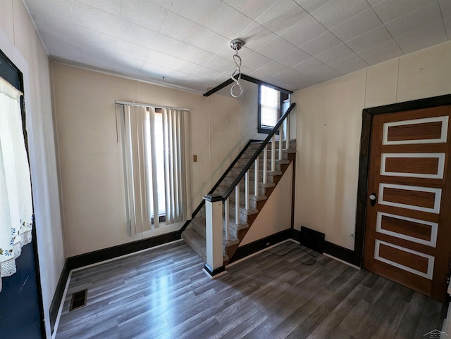 208 State St, Bay City, MI 48706 - entryway with stairs, dark wood-style floors, and baseboards