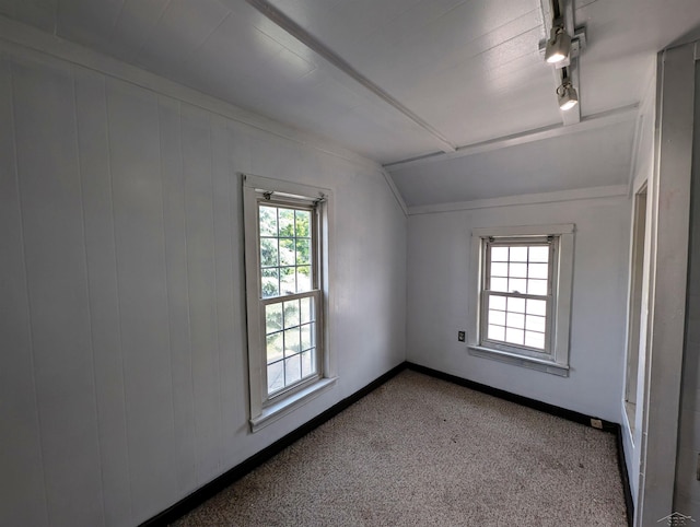 208 State St, Bay City, MI 48706 - carpeted empty room with lofted ceiling and baseboards