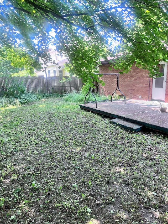 140 Pershing Dr NE, Grand Rapids, MI 49505 - view of yard featuring a wooden deck