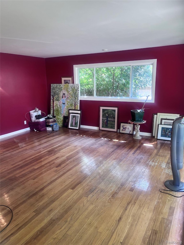 140 Pershing Dr NE, Grand Rapids, MI 49505 - living room featuring wood finished floors and baseboards