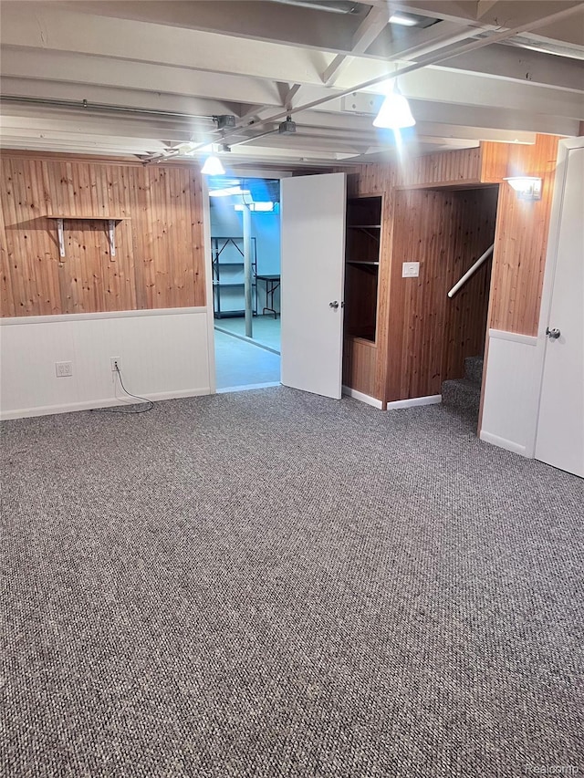 140 Pershing Dr NE, Grand Rapids, MI 49505 - finished basement with wood walls, carpet floors, and stairs
