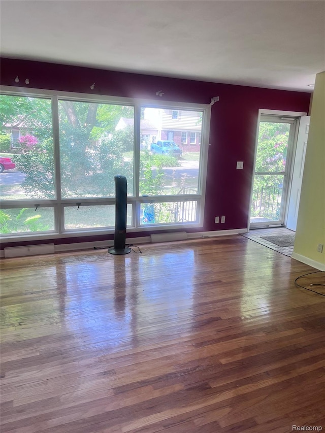 140 Pershing Dr NE, Grand Rapids, MI 49505 - unfurnished room with wood finished floors and baseboards