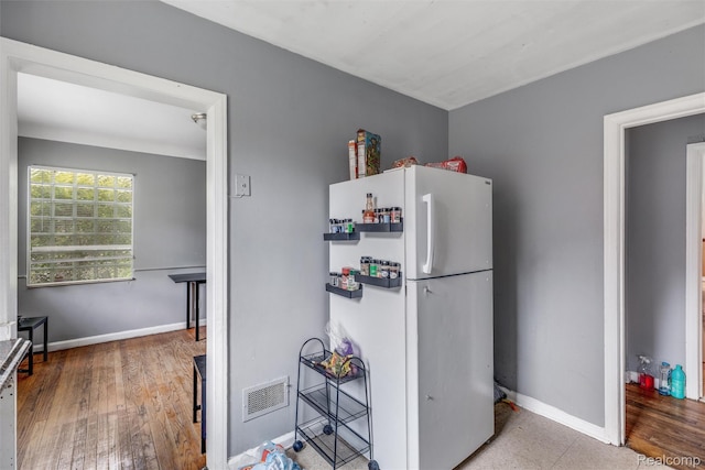 19200 Goulburn St, Detroit, MI 48205 - kitchen featuring freestanding refrigerator, baseboards, and wood finished floors
