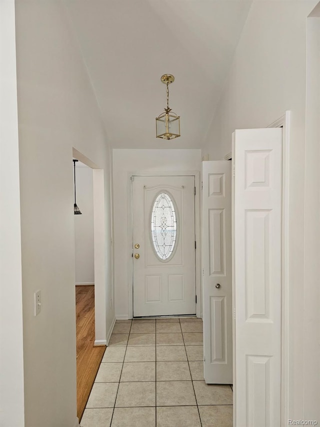 22835 Woodcreek Dr Unit 32, Taylor, MI 48180 - entryway with lofted ceiling, light tile patterned floors, and baseboards