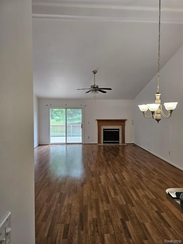 22835 Woodcreek Dr Unit 32, Taylor, MI 48180 - unfurnished living room with dark wood finished floors, a ceiling fan, a chandelier, a fireplace, and lofted ceiling