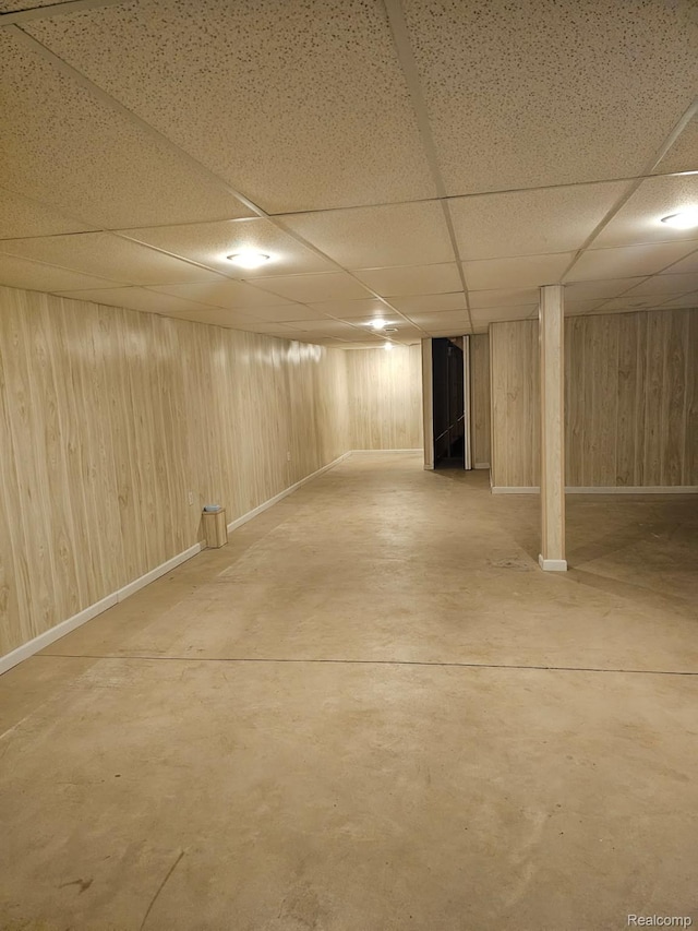 22835 Woodcreek Dr Unit 32, Taylor, MI 48180 - finished basement with a paneled ceiling, wood walls, and baseboards