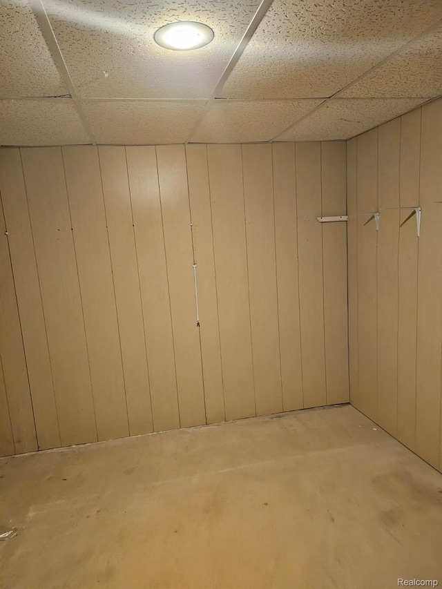 22835 Woodcreek Dr Unit 32, Taylor, MI 48180 - below grade area with a paneled ceiling and wood walls