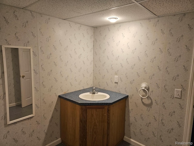 22835 Woodcreek Dr Unit 32, Taylor, MI 48180 - bathroom with vanity, a paneled ceiling, and baseboards