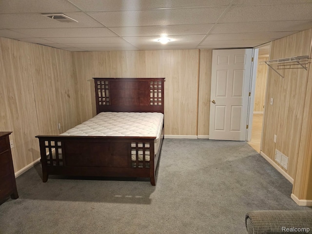 22835 Woodcreek Dr Unit 32, Taylor, MI 48180 - carpeted bedroom with wooden walls, a paneled ceiling, and baseboards