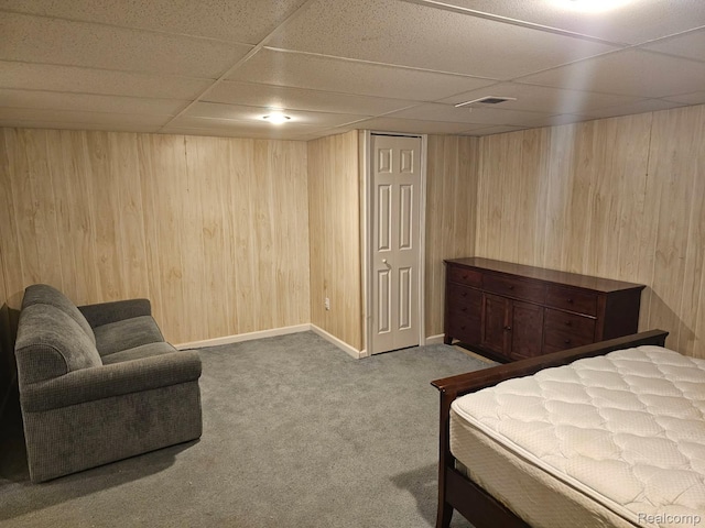 22835 Woodcreek Dr Unit 32, Taylor, MI 48180 - bedroom featuring a paneled ceiling, wood walls, carpet floors, and baseboards