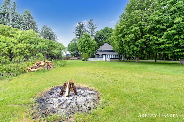 12577 Redmond Ave NE, Cedar Springs, MI 49319 - view of grassy yard with a fire pit