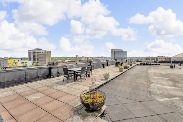 109 W Washington Ave Unit 16, Jackson, MI 49201 - view of patio featuring outdoor dining space and a city view