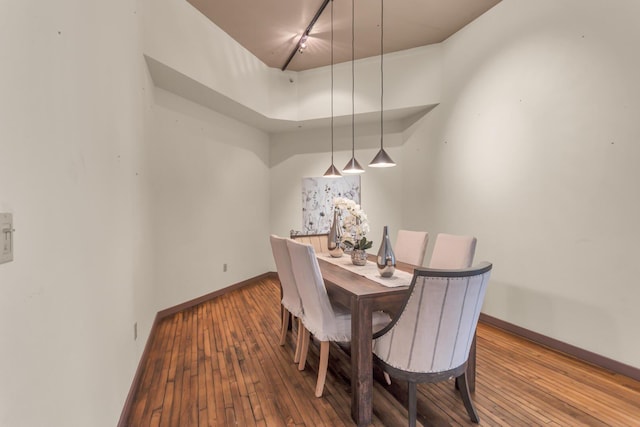 109 W Washington Ave Unit 16, Jackson, MI 49201 - dining area with hardwood / wood-style floors and baseboards