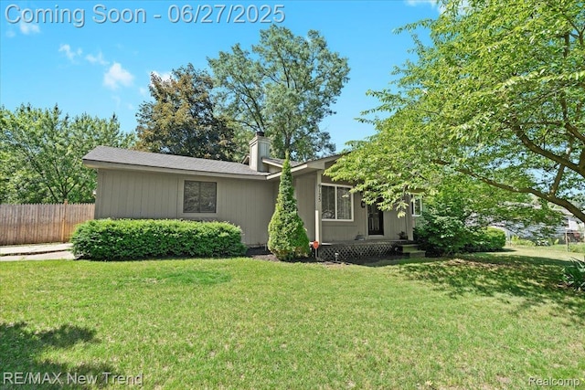 9125 Mandon Rd, White Lake, MI 48386 - view of front of home featuring a chimney