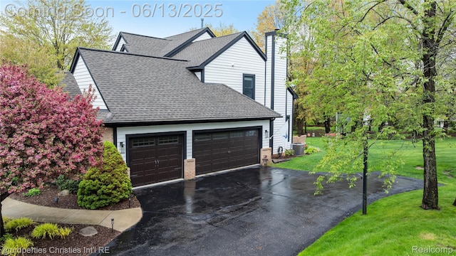 9840 Oak Valley Dr, Clarkston, MI 48348 - garage with driveway and central AC