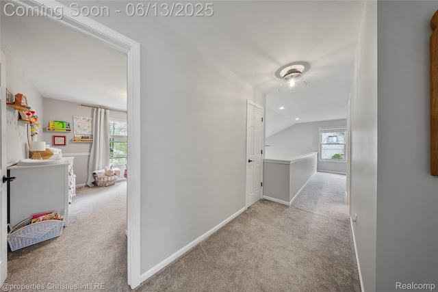 9840 Oak Valley Dr, Clarkston, MI 48348 - hallway with carpet floors, vaulted ceiling, and baseboards