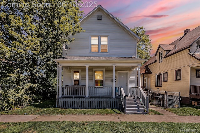 1012 8th St, Port Huron, MI 48060 - view of front of property with covered porch and a gate