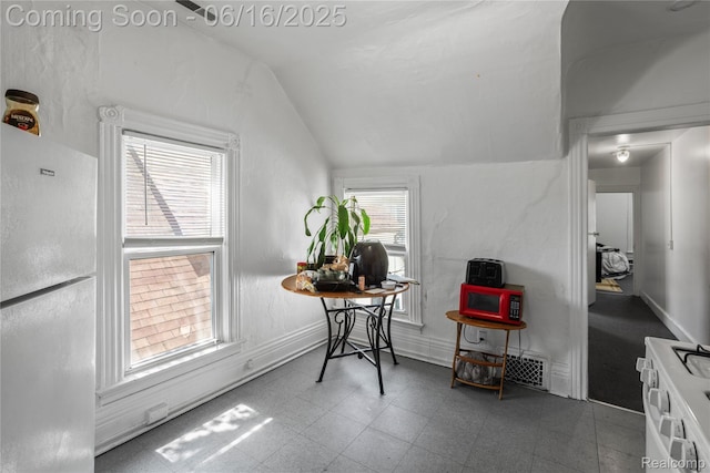 1012 8th St, Port Huron, MI 48060 - dining space featuring lofted ceiling and baseboards
