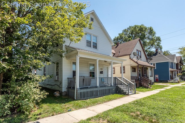 1012 8th St, Port Huron, MI 48060 - traditional style home featuring covered porch and a front yard