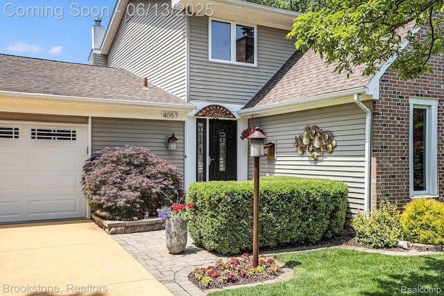 4057 Cypress Dr, Troy, MI 48085 - view of front of property with an attached garage, roof with shingles, brick siding, and a chimney