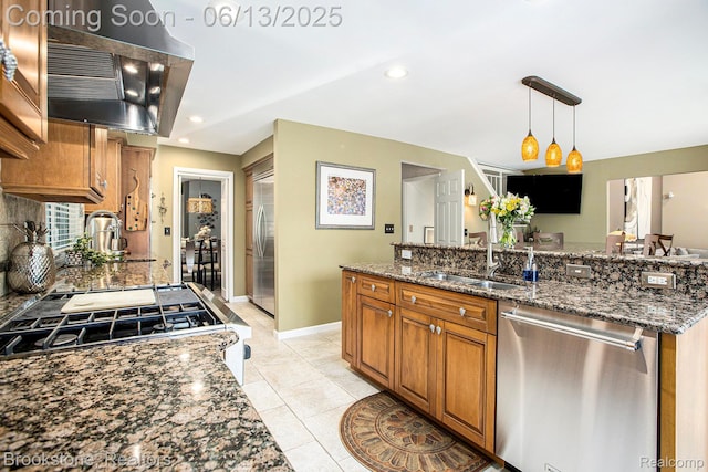 4057 Cypress Dr, Troy, MI 48085 - kitchen featuring stainless steel appliances, a sink, brown cabinetry, extractor fan, and dark stone countertops