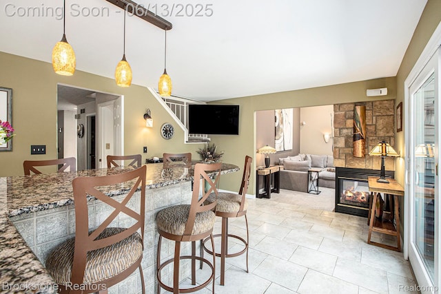4057 Cypress Dr, Troy, MI 48085 - dining area featuring stairway, a fireplace, light tile patterned floors, and baseboards