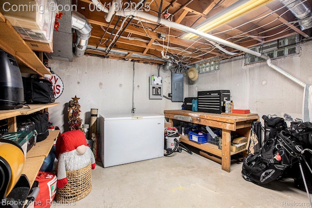 4057 Cypress Dr, Troy, MI 48085 - unfinished basement featuring white fridge, a workshop area, and electric panel