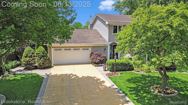 4057 Cypress Dr, Troy, MI 48085 - view of front of property with concrete driveway, an attached garage, a front lawn, and roof with shingles