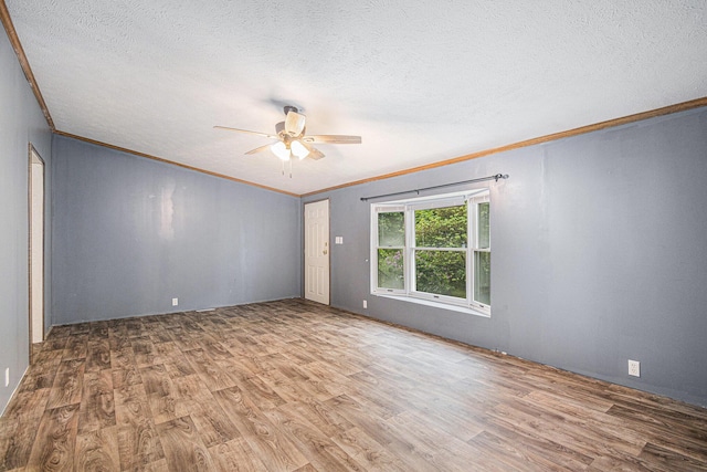 67173 Bulhand Rd, Cassopolis, MI 49031 - empty room featuring crown molding, a ceiling fan, wood finished floors, and a textured ceiling