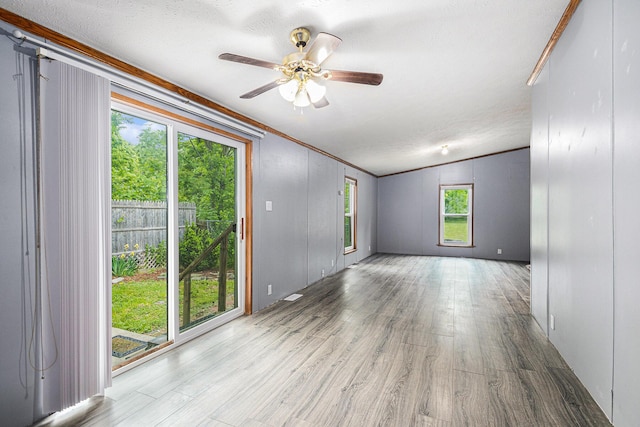 67173 Bulhand Rd, Cassopolis, MI 49031 - empty room featuring wood finished floors, ceiling fan, and ornamental molding