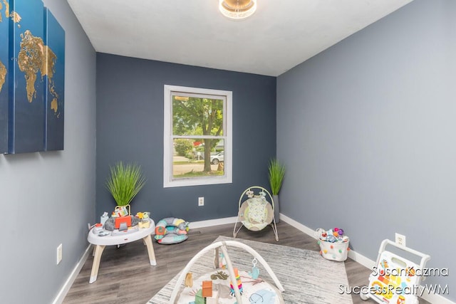111 W 1st Ave, Plainwell, MI 49080 - playroom featuring baseboards and wood finished floors