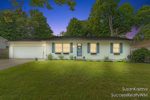 111 W 1st Ave, Plainwell, MI 49080 - ranch-style house with an attached garage and concrete driveway