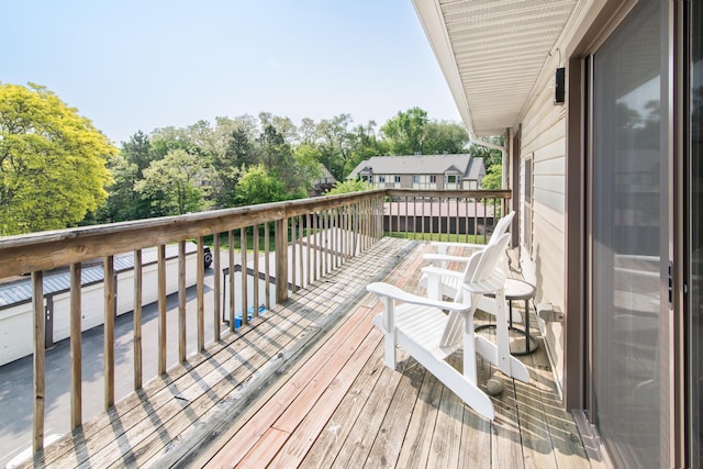 855 S Pontiac Trl Unit A305, Walled Lake, MI 48390 - wooden terrace featuring view of scattered trees