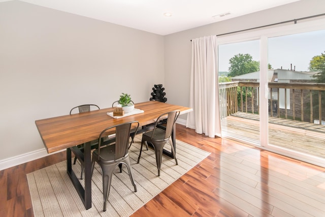 855 S Pontiac Trl Unit A305, Walled Lake, MI 48390 - dining area with baseboards, wood finished floors, and recessed lighting