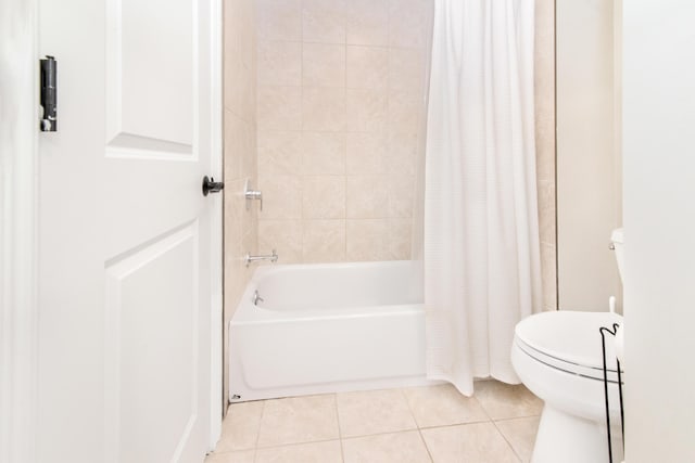 855 S Pontiac Trl Unit A305, Walled Lake, MI 48390 - bathroom with toilet, tile patterned floors, and shower / bath combo with shower curtain