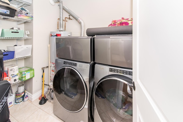 855 S Pontiac Trl Unit A305, Walled Lake, MI 48390 - laundry room with tile patterned floors and stacked washer / drying machine