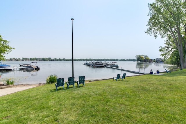 855 S Pontiac Trl Unit A305, Walled Lake, MI 48390 - dock area with a lawn and a water view