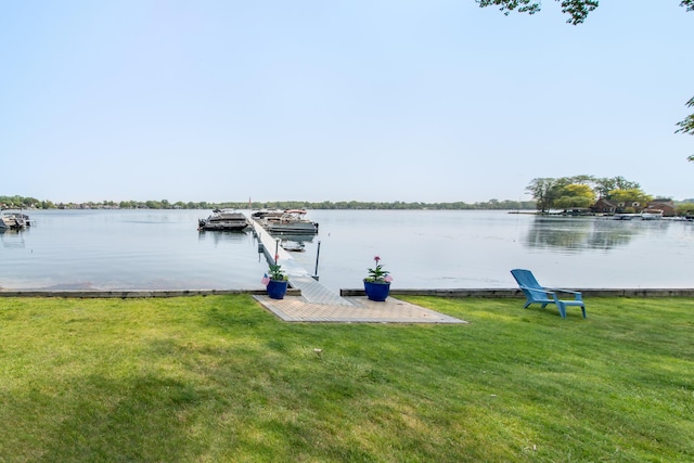 855 S Pontiac Trl Unit A305, Walled Lake, MI 48390 - dock area featuring a water view and a lawn