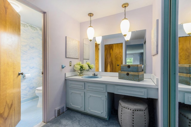 1349 King George Blvd, Ann Arbor, MI 48108 - full bath with toilet, vanity, and baseboards
