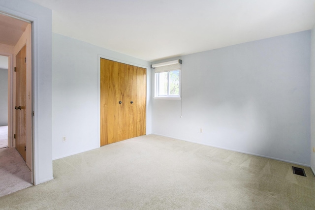 1349 King George Blvd, Ann Arbor, MI 48108 - unfurnished bedroom featuring carpet flooring and a closet