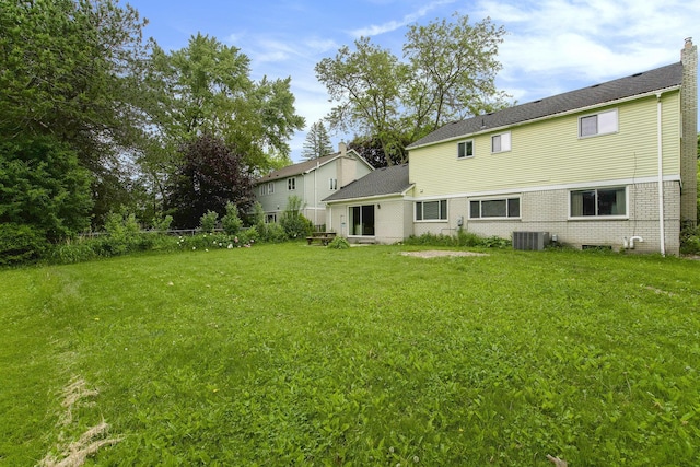 1349 King George Blvd, Ann Arbor, MI 48108 - back of property featuring central air condition unit and brick siding