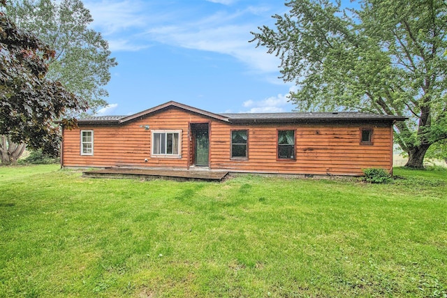 6727 Youngren Rd, Three Oaks, MI 49128 - rear view of house featuring a yard