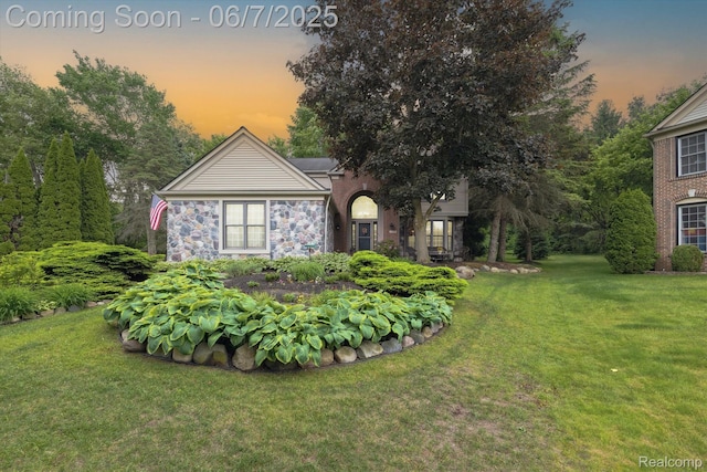 3753 Rolling Hills Rd, Lake Orion, MI 48359 - view of front of house with a yard and stone siding