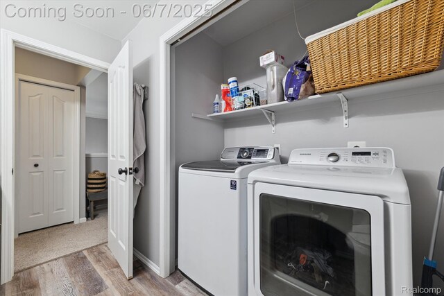 3753 Rolling Hills Rd, Lake Orion, MI 48359 - washroom with washing machine and clothes dryer and light wood-style flooring