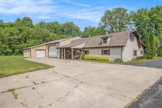 3660 Buffalo Rd, Niles, MI 49120 - view of front of property featuring a front lawn, roof with shingles, driveway, and an attached garage
