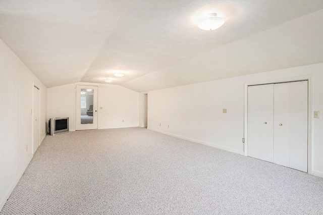 3660 Buffalo Rd, Niles, MI 49120 - additional living space with lofted ceiling, light carpet, and baseboards