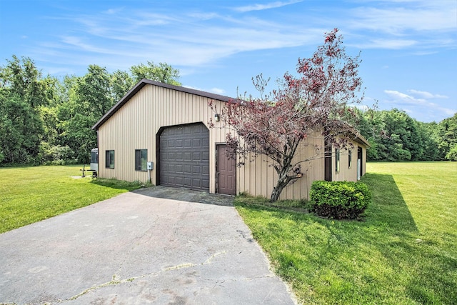 3660 Buffalo Rd, Niles, MI 49120 - view of front of home with asphalt driveway, a garage, a front yard, and an outbuilding